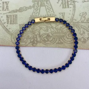 PULSEIRA DOURADA CRAVEJADA EM ZIRCÔNIAS SAFIRA