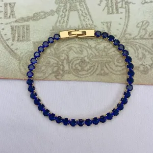 PULSEIRA DOURADA CRAVEJADA EM ZIRCÔNIAS SAFIRA