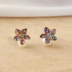 BRINCO FLOR CRAVEJADO EM MICROZIRCÔNIAS COLORIDAS E PÉROLA
