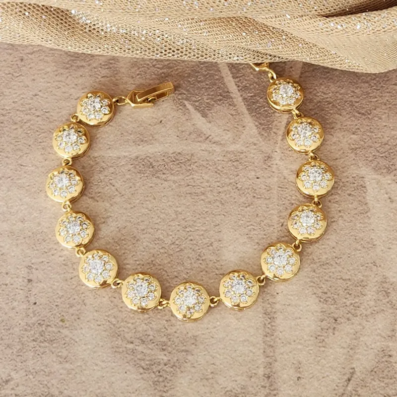 PULSEIRA DOURADA FLÔR CRAVEJADA EM MICROZIRCÔNIAS CRISTAL