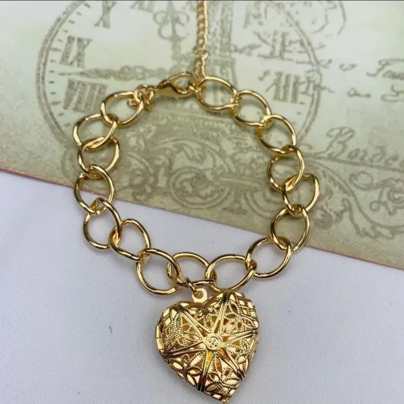 PULSEIRA DOURADA RELICÁRIO CORAÇÃO VAZADO