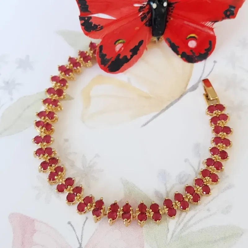 PULSEIRA DOURADA RIVIERA ZIRCÔNIAS RUBI
