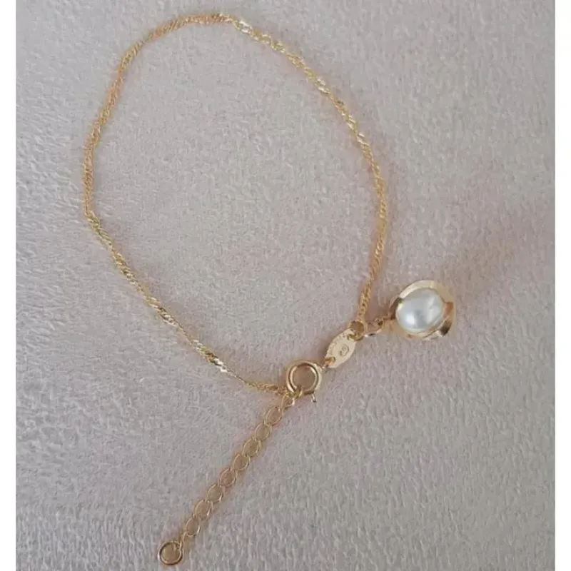 PULSEIRA SINGAPURA COM PINGENTE DOURADO PÉROLA