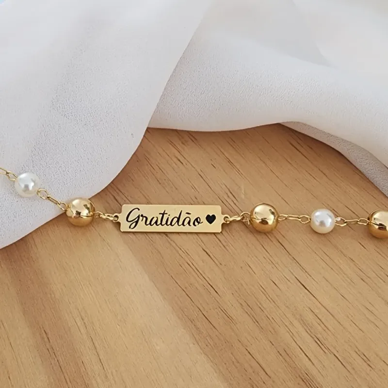 PULSEIRA DOURADA PLAQUINHA GRATIDÃO BOLA LISA E PÉROLA