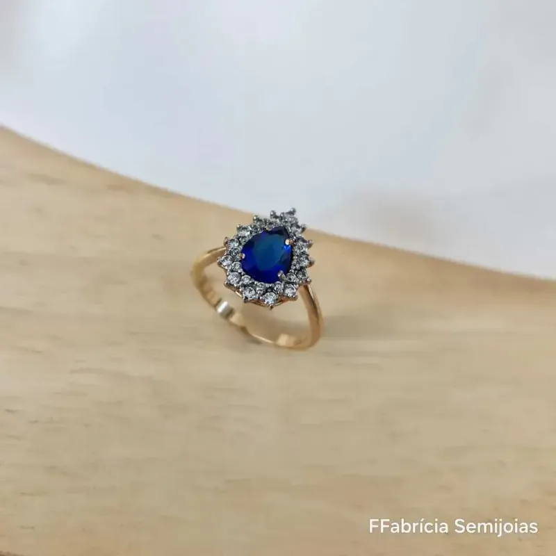 ANEL DOURADO PEDRA AZUL GOTA