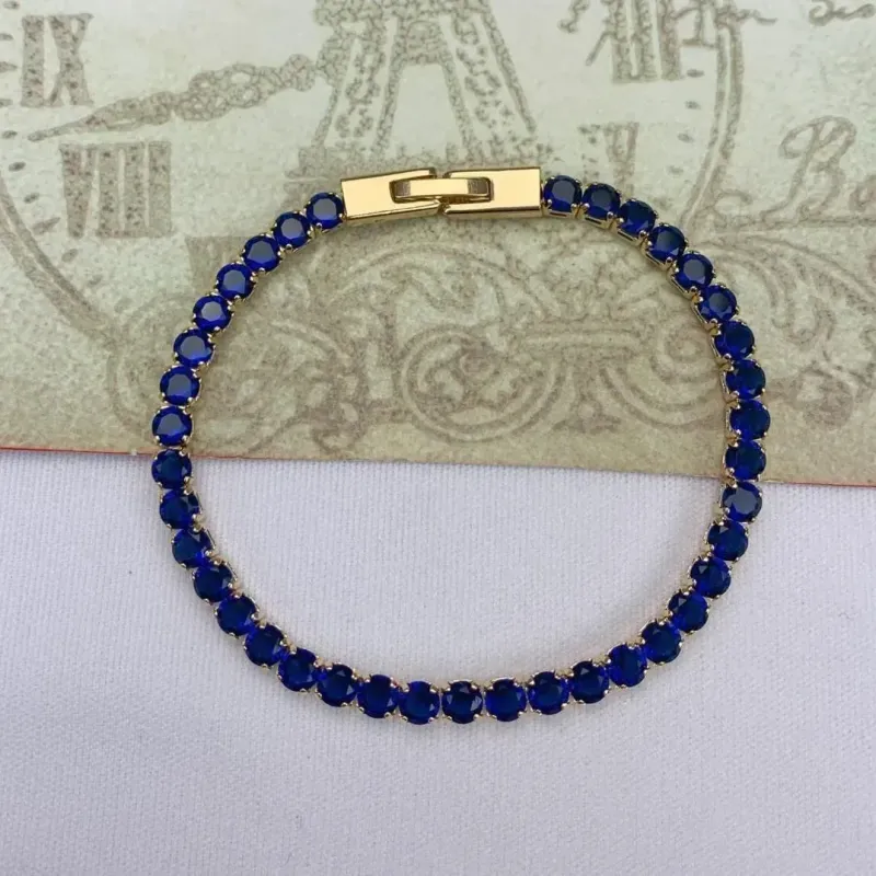 PULSEIRA DOURADA CRAVEJADA EM ZIRCÔNIAS SAFIRA
