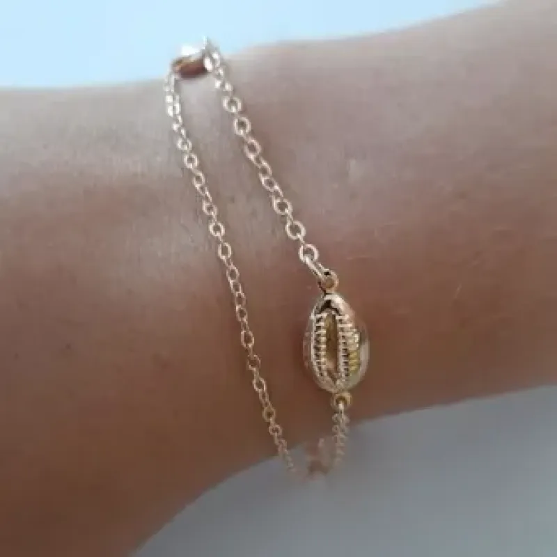 PULSEIRA DOURADA DOIS FIOS BÚZIOS