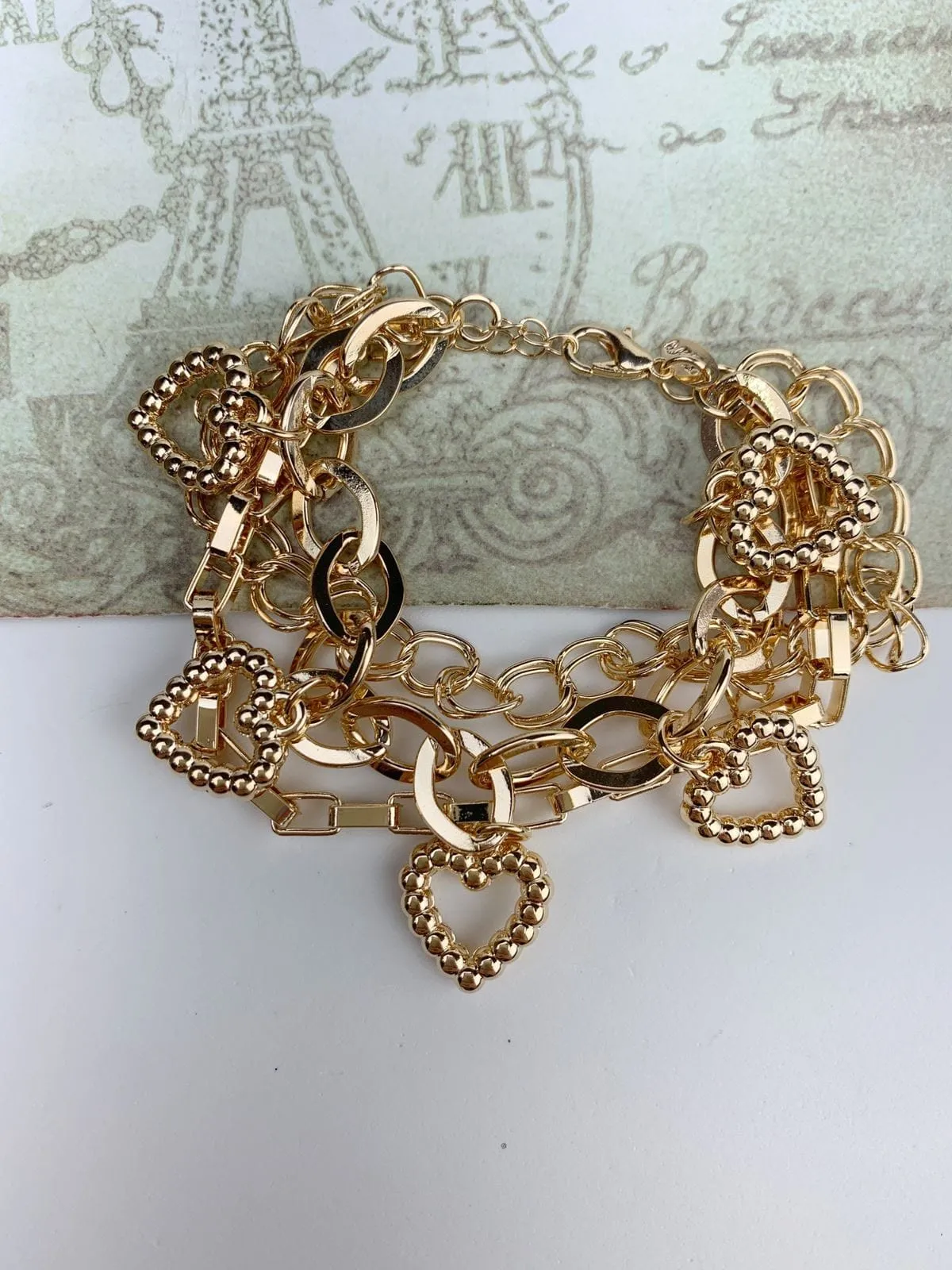 PULSEIRA TRÊS EM UMA PINGENTES CORAÇÕES