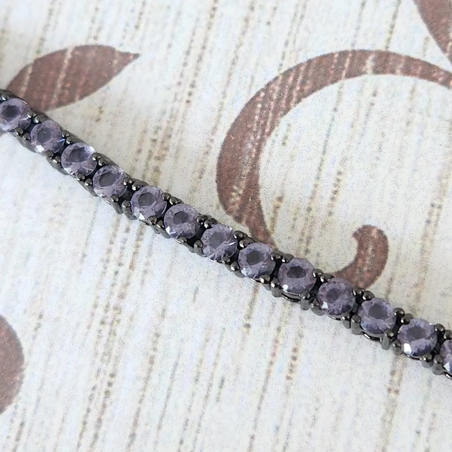 PULSEIRA RÓDIO NEGRO ZIRCÔNIAS LILÁS