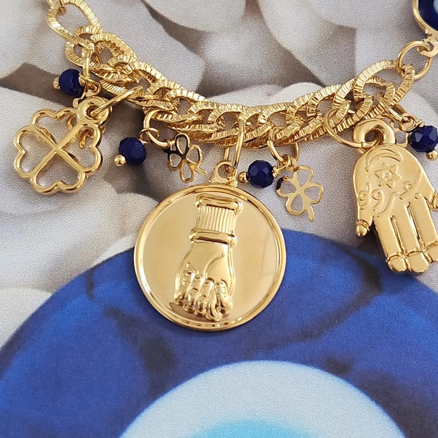 PULSEIRA DOURADA PATUÁ OLHO GREGO,TREVO DE QUATRO FOLHAS, MÃO DE FATIMA E FIGA