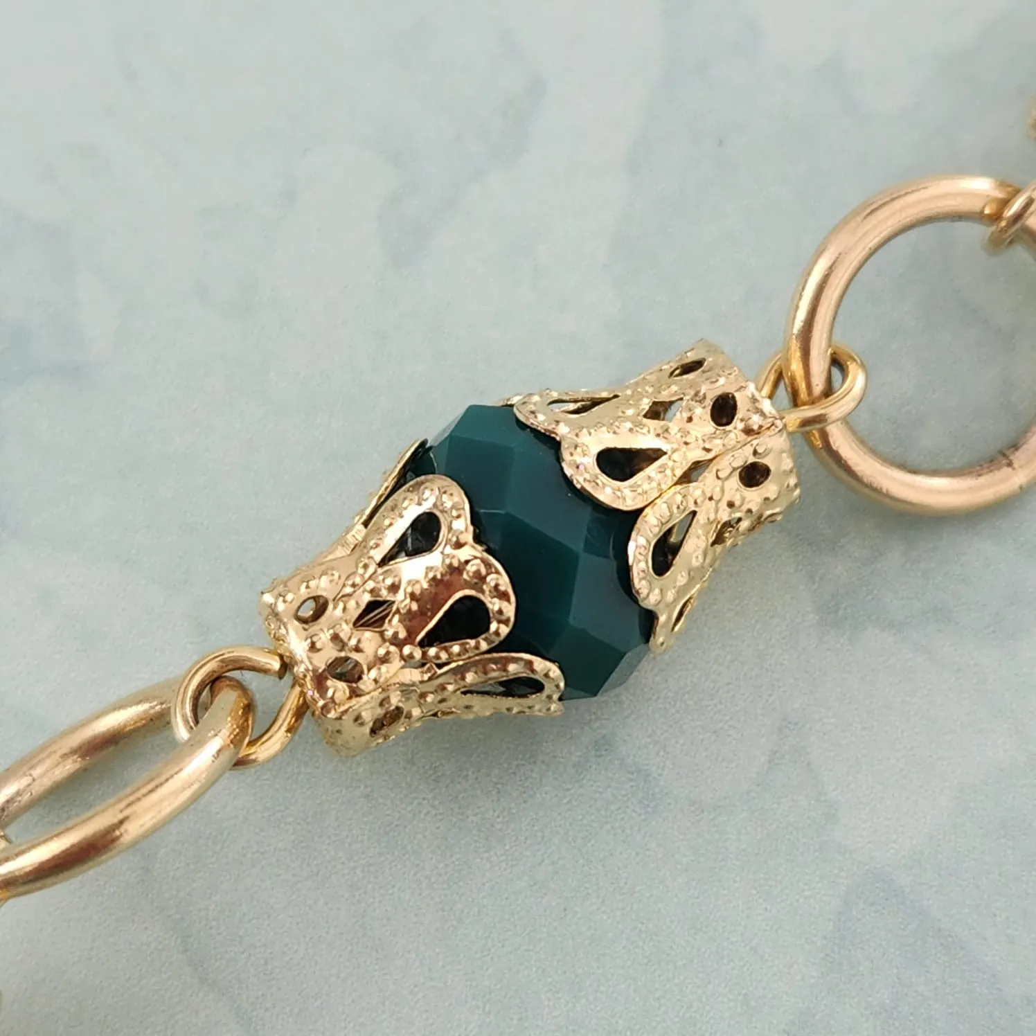 PULSEIRA DOURADA PEDRAS VERDES
