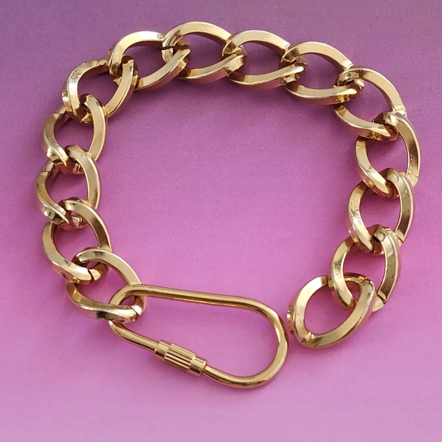 PULSEIRA  DOURADA ELOS GRANDES TRANÇADOS FECHO MOSQUETÃO