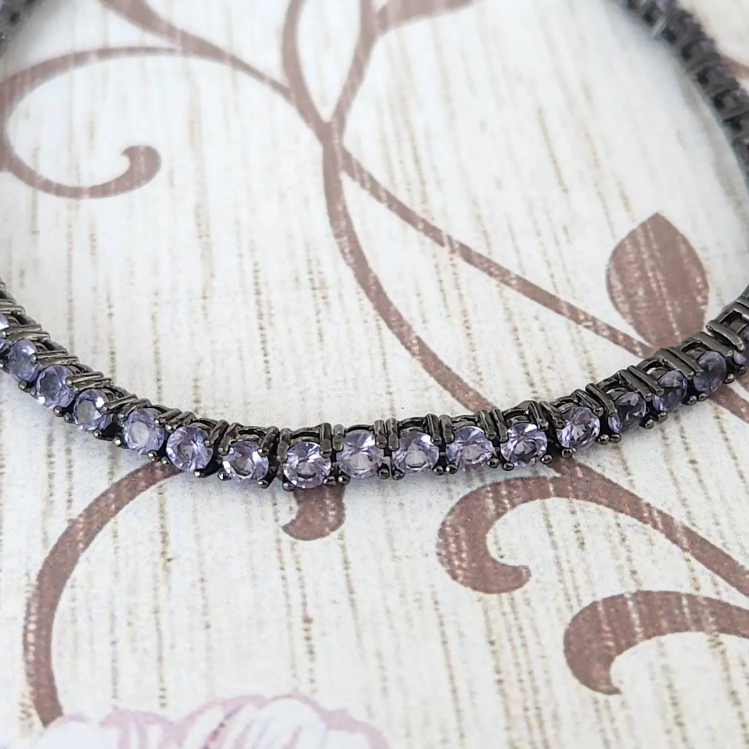 PULSEIRA RÓDIO NEGRO ZIRCÔNIAS LILÁS