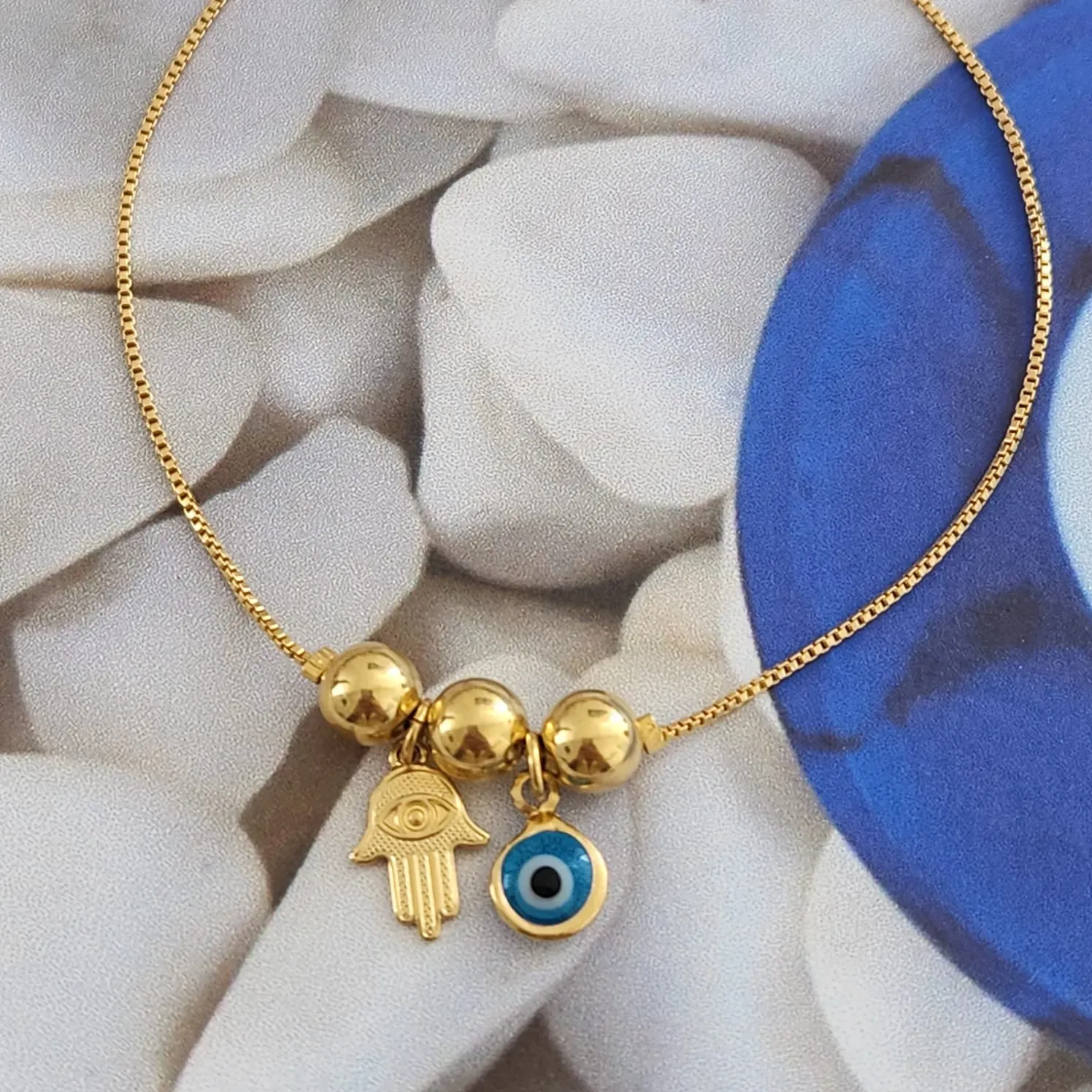 PULSEIRA DOURADA OLHO GREGO E MÃO DE FÁTIMA