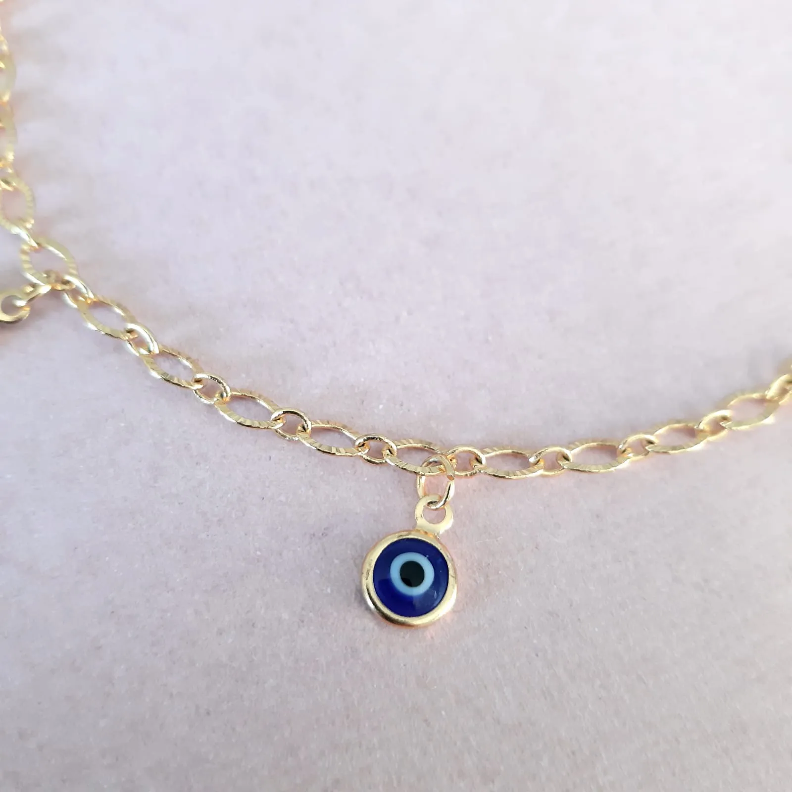 PULSEIRA DOURADA PINGENTES OLHO GREGO
