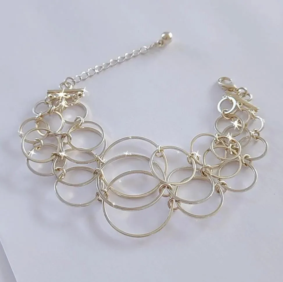 PULSEIRA ELOS CIRCULARES BANHO DE PRATA