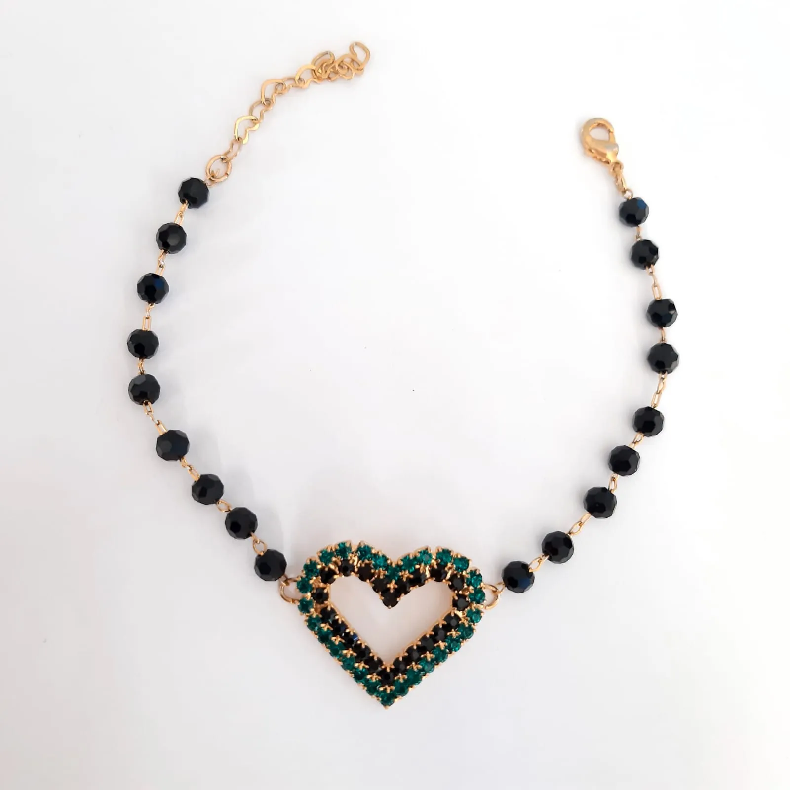 PULSEIRA DOURADA CORAÇÃO CRAVEJADO ZIRCÔNIAS NEGRAS