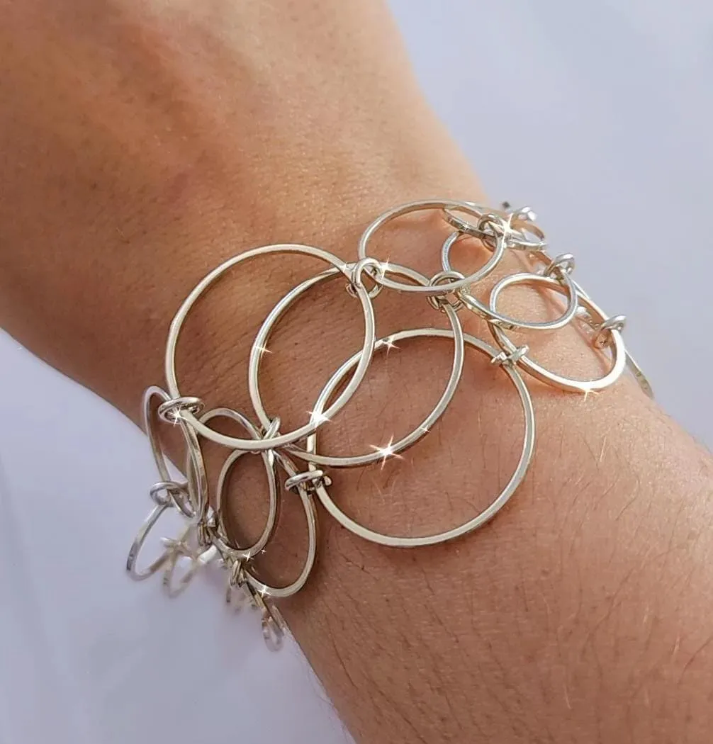 PULSEIRA ELOS CIRCULARES BANHO DE PRATA