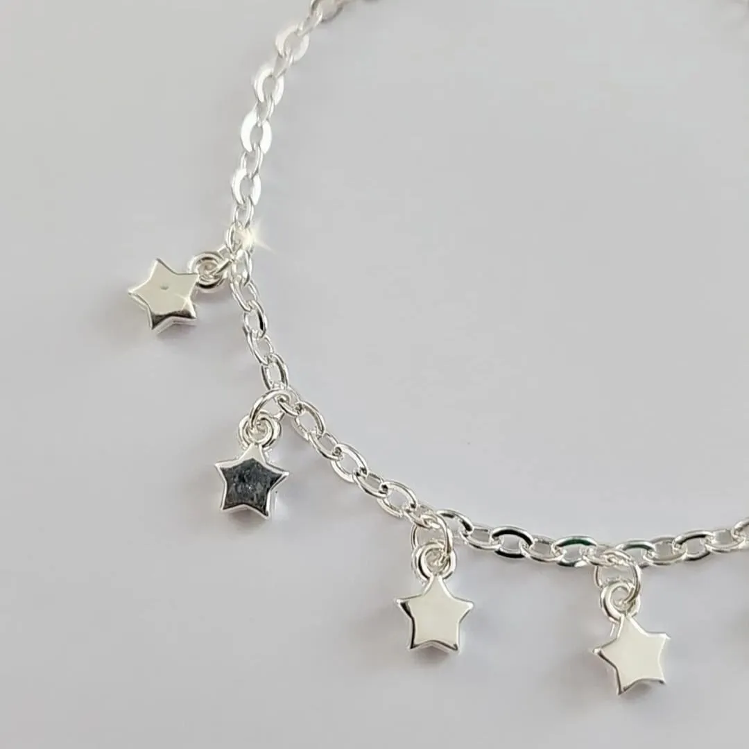 PULSEIRA INFANTIL PINGENTES ESTRELAS