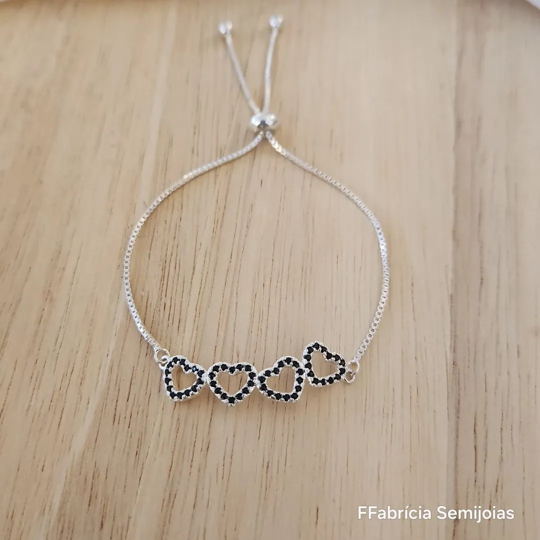 PULSEIRA BANHO DE PRATA CORAÇÃO CRAVEJADO ZIRCÔNIAS NEGRAS