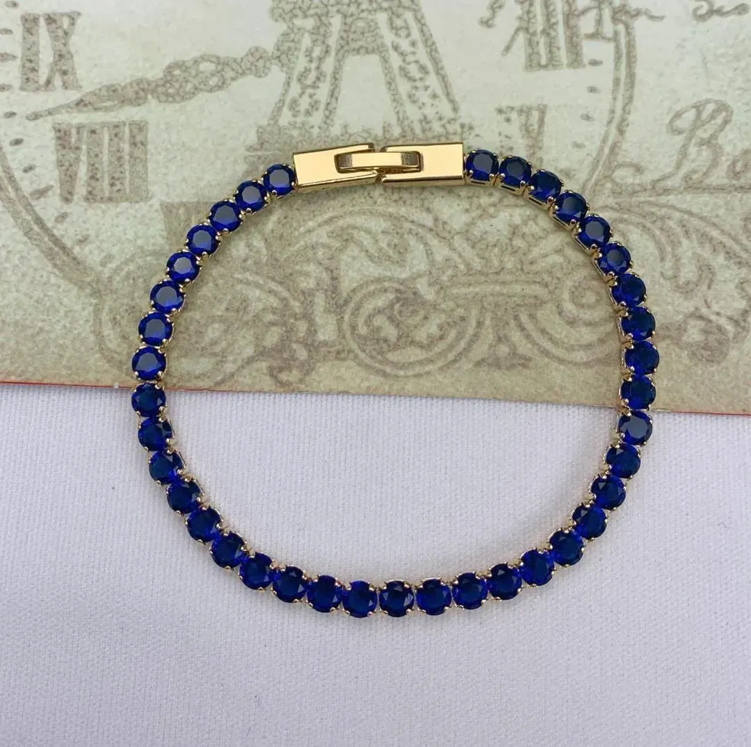 PULSEIRA DOURADA CRAVEJADA EM ZIRCÔNIAS SAFIRA
