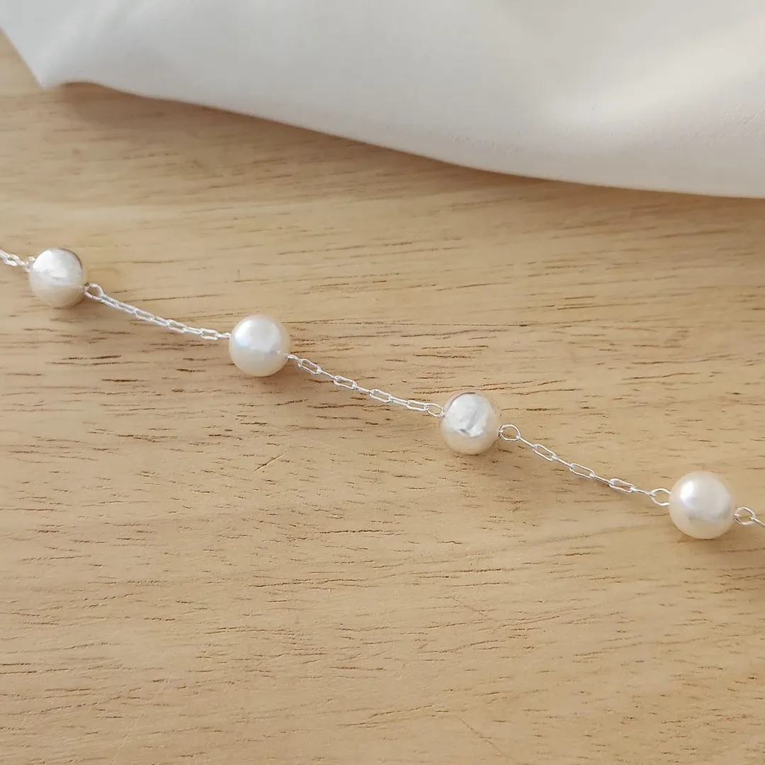 PULSEIRA COM DUAS PÉROLAS E DUAS BOLAS 10MM