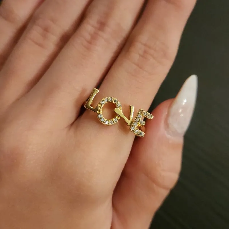 ANEL DOURADO LOVE CRAVEJADO MICROZIRCÔNIAS CRISTAL